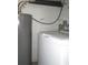 Functional laundry area features washer and water heater, offering essential convenience at 8544 Herbison Ave, North Port, FL 34287