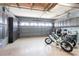 Spacious garage with ample storage, epoxy flooring, and a large door for easy access at 10227 Windsong Rd, Punta Gorda, FL 33955