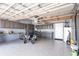 Well-organized garage with epoxy flooring, storage cabinets, and space for multiple vehicles at 10227 Windsong Rd, Punta Gorda, FL 33955