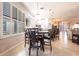 Open-concept kitchen and dining area with tile floors and lots of natural light at 10227 Windsong Rd, Punta Gorda, FL 33955