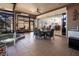 Bright sunroom featuring a hot tub, dining set, tile flooring, and access to the home's interior at 10227 Windsong Rd, Punta Gorda, FL 33955