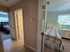Bedroom view showcasing a cozy interior with twin beds, bedside table, and natural light at 1173 Belkton Ave, Port Charlotte, FL 33948
