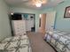 Bedroom featuring twin beds, a closet, a TV on a dresser and a neutral color scheme at 1173 Belkton Ave, Port Charlotte, FL 33948