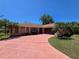 Charming single-story home with a spacious driveway and well-maintained landscaping at 1173 Belkton Ave, Port Charlotte, FL 33948