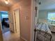 Hallway view showcasing doors to the bedrooms, highlighting the layout and access within the home at 1173 Belkton Ave, Port Charlotte, FL 33948
