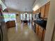 Bright kitchen area with modern appliances and a dining area with pool views at 1173 Belkton Ave, Port Charlotte, FL 33948
