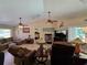 Comfortable living room with plush furniture and a view to the screened patio at 1173 Belkton Ave, Port Charlotte, FL 33948