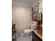 Elegant bathroom with modern fixtures and decorative chandelier at 1233 Dewhurst St, Port Charlotte, FL 33952