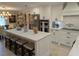 Updated kitchen featuring stainless steel appliances, a center island, and bright white cabinetry at 1233 Dewhurst St, Port Charlotte, FL 33952