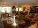 A classically decorated living room filled with elegant furniture, art, and decorative items at 1233 Dewhurst St, Port Charlotte, FL 33952