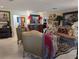 Elegant living room with ornate furnishings, striking artwork, and tile flooring at 1233 Dewhurst St, Port Charlotte, FL 33952