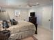 Spacious main bedroom with a king bed, ensuite bathroom, and ample natural light at 1233 Dewhurst St, Port Charlotte, FL 33952