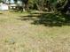 Grassy residential lot ready for building, close to mature trees at 1233 Dewhurst St, Port Charlotte, FL 33952