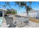 Backyard patio featuring outdoor seating, with a view of the pool and garden at 1249 Indus, Venice, FL 34293