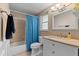 Bright bathroom with new vanity and faucet, shower and tub combo, and neutral decor at 1249 Indus, Venice, FL 34293