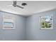 Bright bedroom with large windows, ceiling fan, and neutral walls at 1249 Indus, Venice, FL 34293