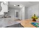 Bright kitchen featuring granite countertops, stainless steel sink, and white cabinets at 1249 Indus, Venice, FL 34293