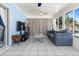 Inviting sunroom with tile floors, ceiling fans, comfortable seating, and views of the pool and backyard at 1249 Indus, Venice, FL 34293