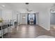 Spacious living room with wood floors, ceiling fan, and lots of natural light at 1249 Indus, Venice, FL 34293