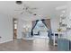 Cozy living room with a view of the lanai, ceiling fan, and stylish blue and brown curtains at 1249 Indus, Venice, FL 34293