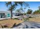 Wide angle view of the backyard including patio, pool and sunroom at 1249 Indus, Venice, FL 34293