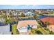 Aerial view of property surrounded by canals, showcasing its proximity to the water and neighborhood at 125 Donna Ct, Punta Gorda, FL 33950
