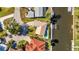 Aerial view of a home featuring a backyard pool and a private boat dock on the canal at 125 Donna Ct, Punta Gorda, FL 33950