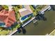 Waterfront home aerial showcasing a private pool, dock, and scenic canal views at 125 Donna Ct, Punta Gorda, FL 33950