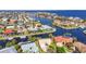 Picturesque aerial showcasing homes along waterfront canals, providing boating access in a serene coastal community at 125 Donna Ct, Punta Gorda, FL 33950