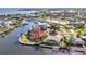High angle view presents coastal properties with boat docks and canal access to the bay, offering premium amenities at 125 Donna Ct, Punta Gorda, FL 33950