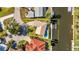 Aerial view of property featuring a waterfront location, a pool, and a private dock on a canal at 125 Donna Ct, Punta Gorda, FL 33950
