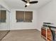 Bedroom featuring laminate floors, a closet with mirrored doors, and a ceiling fan at 125 Donna Ct, Punta Gorda, FL 33950