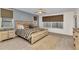 Inviting bedroom with a wood-framed bed, neutral color palette, and ample natural light at 125 Donna Ct, Punta Gorda, FL 33950