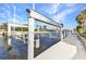 Private boat lift and dock on the waterfront, offering convenient access to boating and water activities at 125 Donna Ct, Punta Gorda, FL 33950