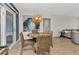 Charming dining area with a unique table, wicker chairs, and an attractive light fixture at 125 Donna Ct, Punta Gorda, FL 33950