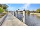 Private boat dock showcasing waterfront access and community views with power connections at 125 Donna Ct, Punta Gorda, FL 33950