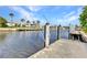 View of the home's private boat dock with space to moor your vessel and enjoy waterfront living at 125 Donna Ct, Punta Gorda, FL 33950
