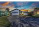 Charming single-Gathering home with a well-maintained lawn and a spacious driveway leading to a two-car garage at 125 Donna Ct, Punta Gorda, FL 33950
