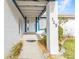 Charming home exterior featuring a walkway leading to the front door, complemented by blue and white accents at 125 Donna Ct, Punta Gorda, FL 33950