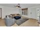Cozy living room with neutral decor, wood floors, comfortable seating, and lots of natural light at 125 Donna Ct, Punta Gorda, FL 33950