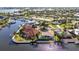 Beautiful waterfront home boasts lush landscaping, dock, and canal access for the avid boater at 125 Donna Ct, Punta Gorda, FL 33950