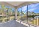 Screened lanai with views of lush tropical landscaping and waterfront canal at 1349 Aqui Esta Dr # 121, Punta Gorda, FL 33950
