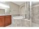 Luxurious bathroom featuring glass shower and soaking tub at 1349 Aqui Esta Dr # 121, Punta Gorda, FL 33950
