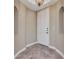 Inviting condo foyer featuring arched doorways and neutral paint at 1349 Aqui Esta Dr # 121, Punta Gorda, FL 33950