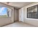 Welcoming hallway with natural light from a window and a white front door at 1349 Aqui Esta Dr # 121, Punta Gorda, FL 33950