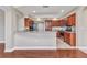 Inviting kitchen with granite countertops, stainless steel appliances and wood cabinets at 1349 Aqui Esta Dr # 121, Punta Gorda, FL 33950