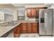 Stylish kitchen with stainless steel appliances and granite countertops at 1349 Aqui Esta Dr # 121, Punta Gorda, FL 33950