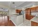 Open kitchen with granite countertops and stainless steel appliances, seamlessly connecting to living area at 1349 Aqui Esta Dr # 121, Punta Gorda, FL 33950