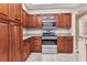 A modern kitchen with stainless steel appliances and granite countertops at 1349 Aqui Esta Dr # 121, Punta Gorda, FL 33950