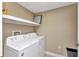 Bright laundry room equipped with a modern washing machine and dryer at 1349 Aqui Esta Dr # 121, Punta Gorda, FL 33950